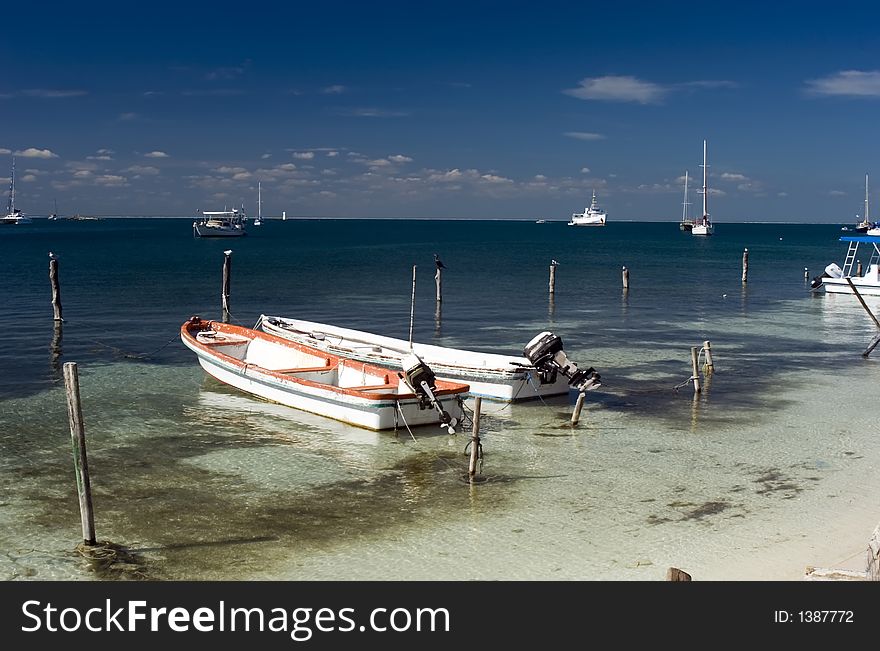 A Fishing Boat on the beach at Isla Mujeres, Mexico. A Fishing Boat on the beach at Isla Mujeres, Mexico.