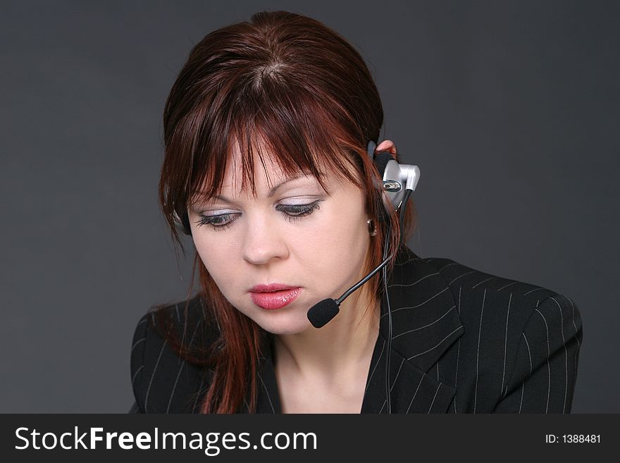 Girl with headset looking down