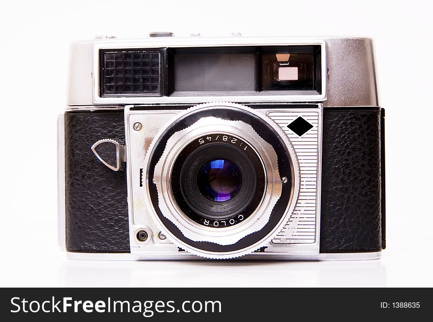 An old 35mm film camera isolated on white. An old 35mm film camera isolated on white