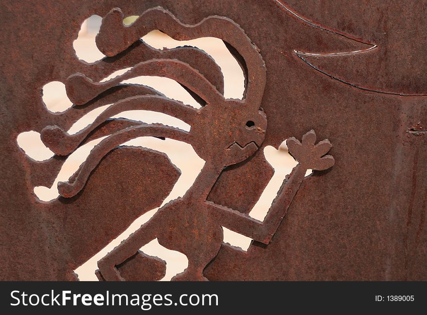 Iron cut-out of kokopelli running. Iron cut-out of kokopelli running