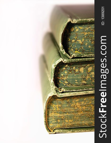 Three old books stacked with white background