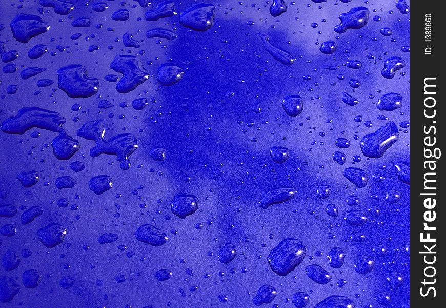 Rain drops on blue surface