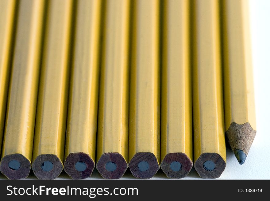 Wooden yellow pencils lined up