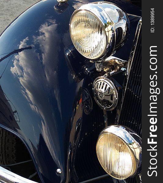 Classic car closeup - side panel, signal and headlamp