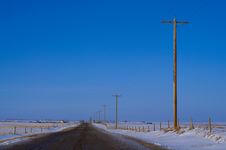 Country Road With Electric Poles Stock Photo