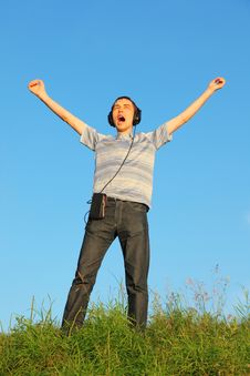 Man Is Standing On A Meadow With Raised Hands Royalty Free Stock Images