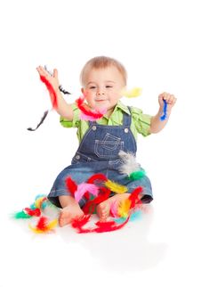 Little Boy Is Sitting On A Flow With Feathers Royalty Free Stock Photo Little Boy Is Sitting On A Flow With Feathers Royalty Free Stock Photo