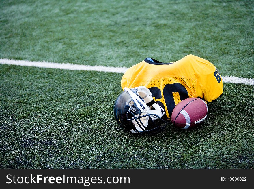 American football equipement on football field. American football equipement on football field