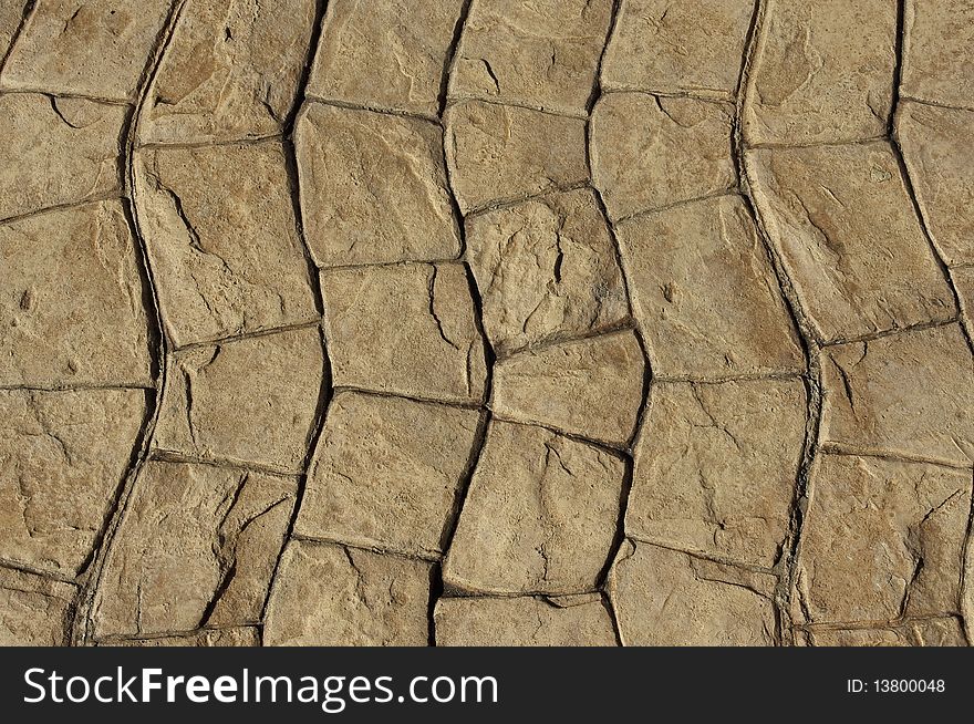 Wavy cobblestone walking path in detail and close-up, shows texture on surface