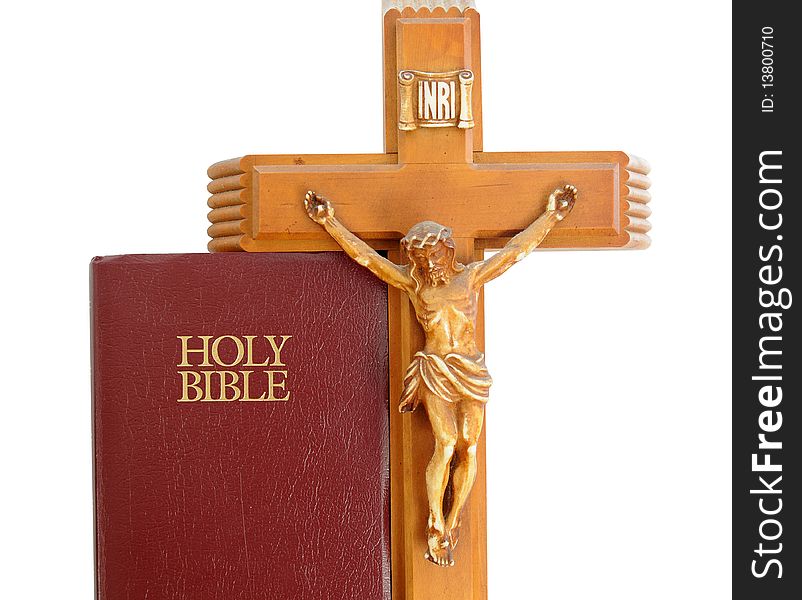 Holy Bible with a red leather cover isolated on a white background with crucifix. Holy Bible with a red leather cover isolated on a white background with crucifix