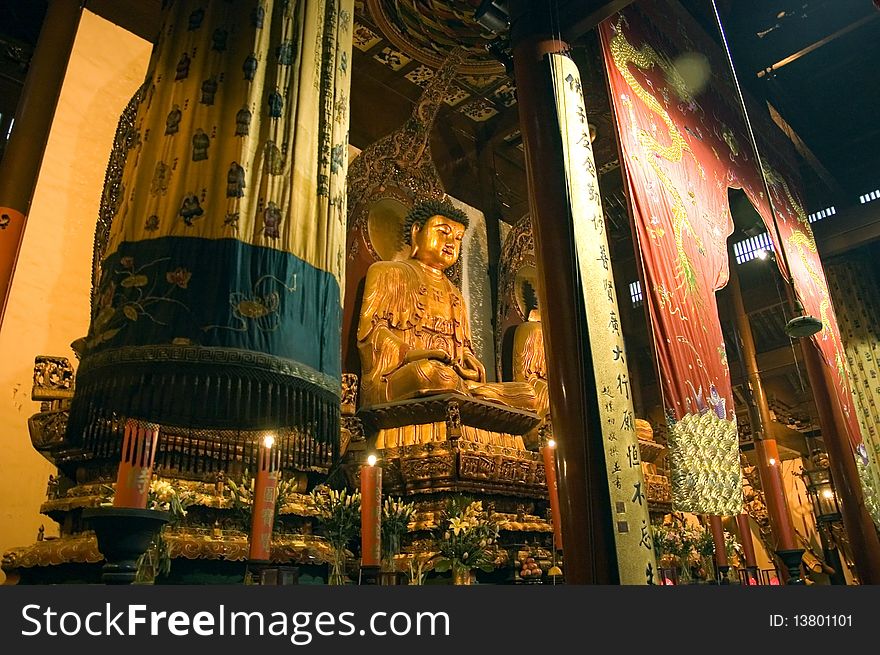 Shanghai, inside Jade Buddha Temple with buddha sculptures and traditional decorations. Shanghai, inside Jade Buddha Temple with buddha sculptures and traditional decorations.