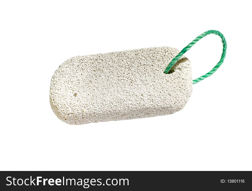 Pumice stone over white with green cord