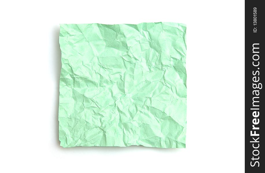 Green crumpled note paper isolated on white background