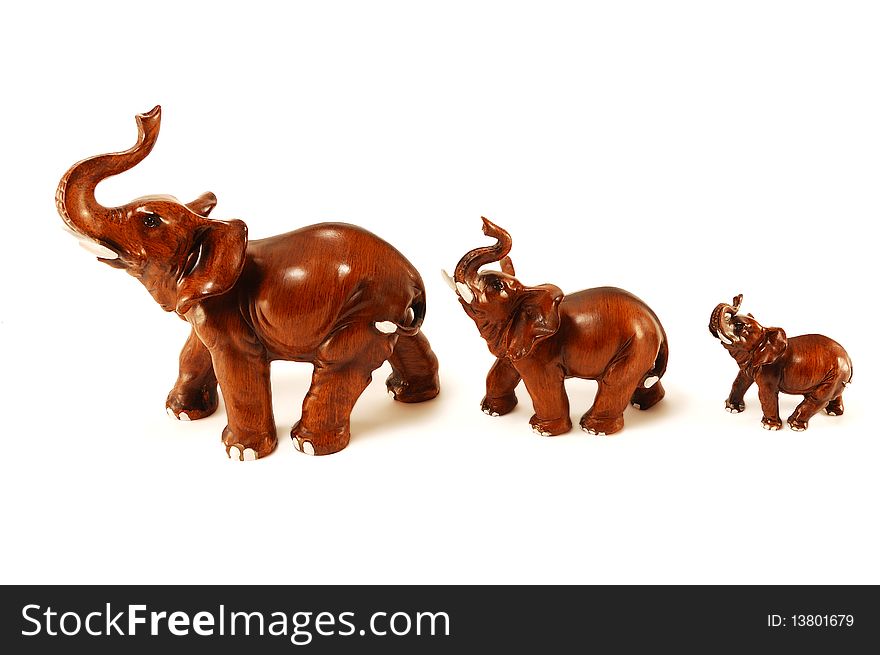 Three wooden elephant isolated on a white background. Three wooden elephant isolated on a white background