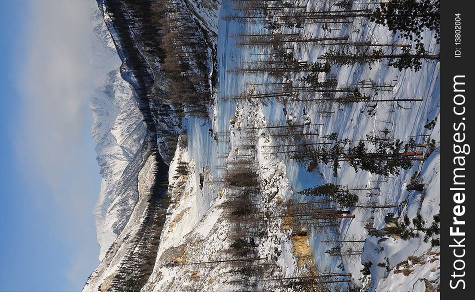 Landscape River under ice in the winter snowy mountain. Landscape River under ice in the winter snowy mountain