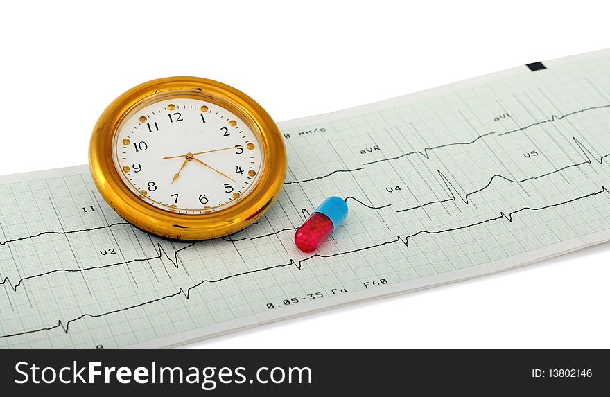 Pill and clock over an printout of a electrocardiogram report. Isolated on white with light shadow. The file includes a clipping path so it is easy to work with. Focus on figure six in clock. Pill and clock over an printout of a electrocardiogram report. Isolated on white with light shadow. The file includes a clipping path so it is easy to work with. Focus on figure six in clock.