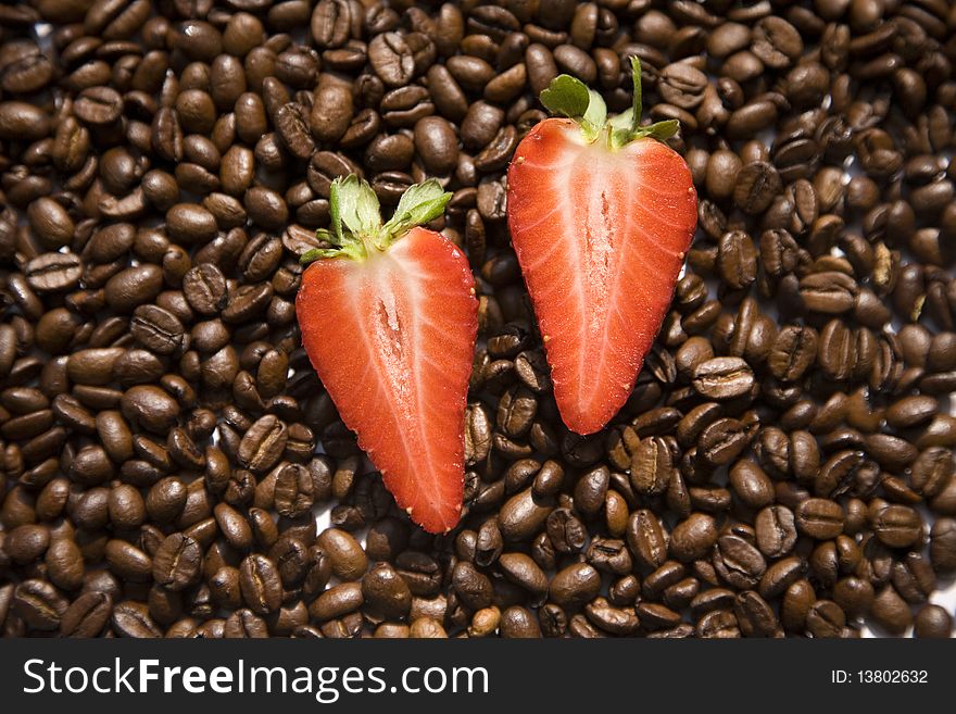 Strawberry on coffee beans texture. Strawberry on coffee beans texture