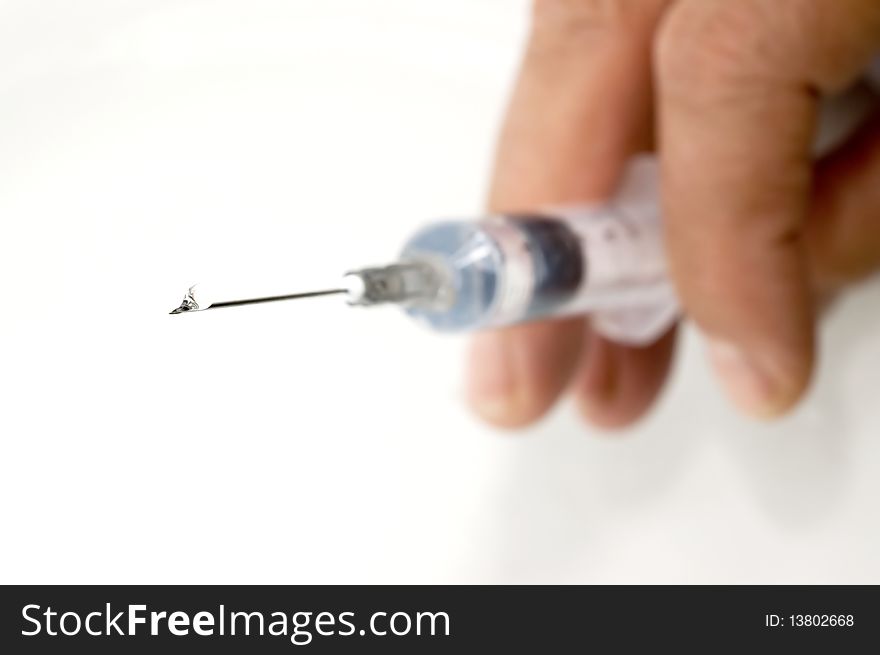 Hand holding an Injection on white background. Hand holding an Injection on white background