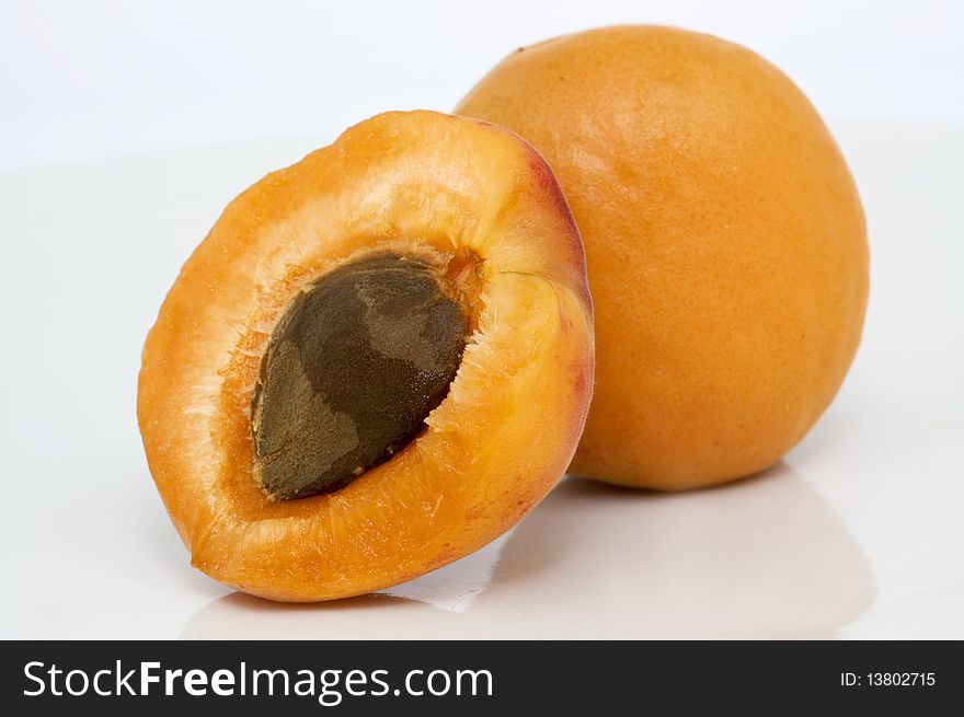 Fresh and juicy apricots isolated on white.It use in alternative medicine.