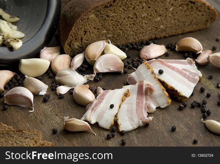 Cut pork fat with garlic pepper and brown bread russian style. Cut pork fat with garlic pepper and brown bread russian style