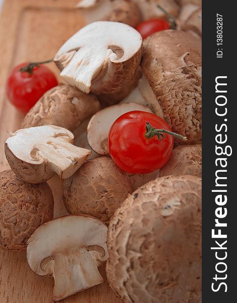 Fresh button mushroom, or champignon with cherry tomato