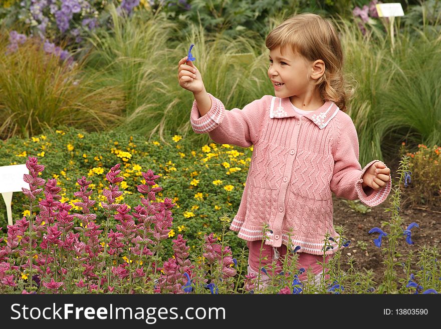 Girl Holding In Her Hand Annual Delphinium