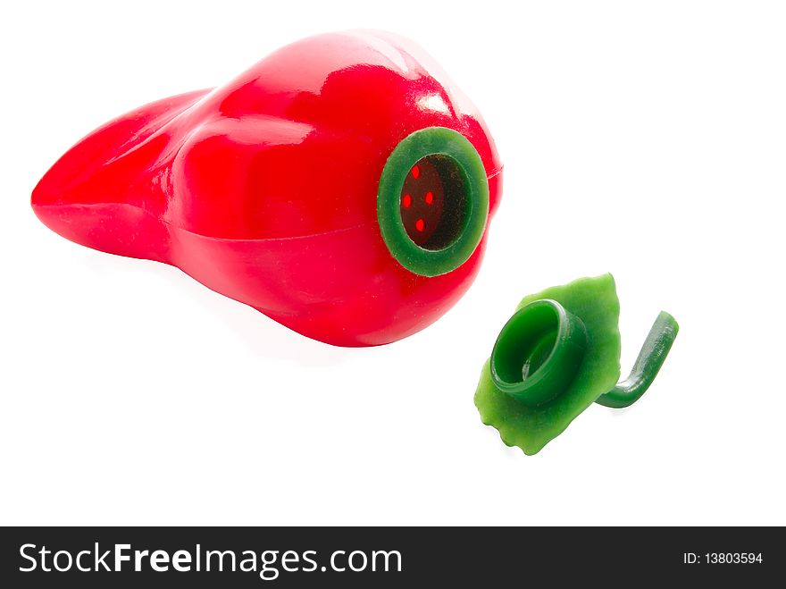 Red pepper shaker in the form of a pepper pod