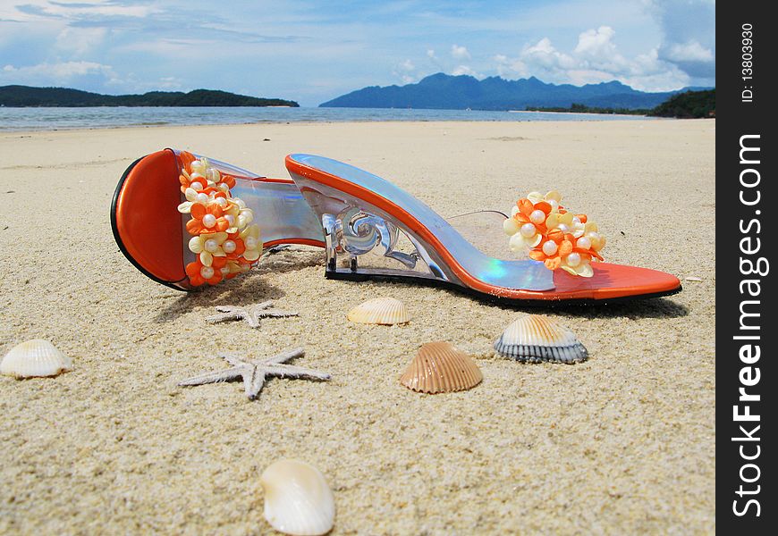 Trandy shoes on the sand of Langkawi island, Malaysia