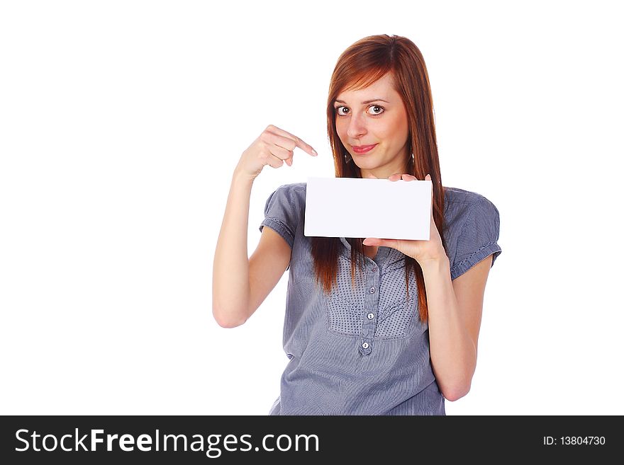 Smiling teenage girl holding an empty card, pointing on it, isolated on white. Smiling teenage girl holding an empty card, pointing on it, isolated on white