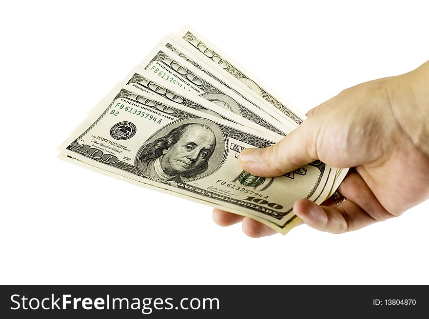 Human hand holding a pile of US dollars (isolated on white). Human hand holding a pile of US dollars (isolated on white)