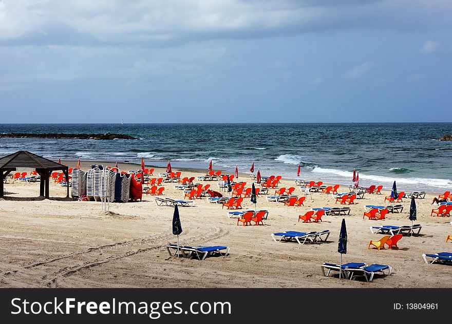 Chairs on the background of blue sea. waiting for tourists