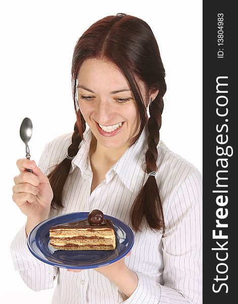 Beautiful woman eating piece of cake on white background