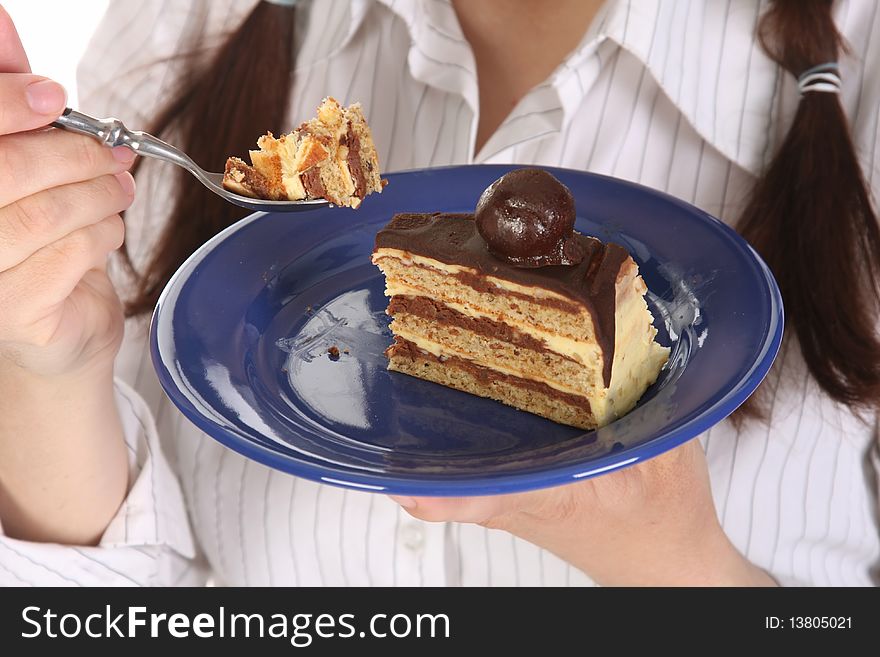 Piece of cake with chocolate in close up