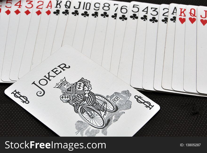 White playing cards and joker