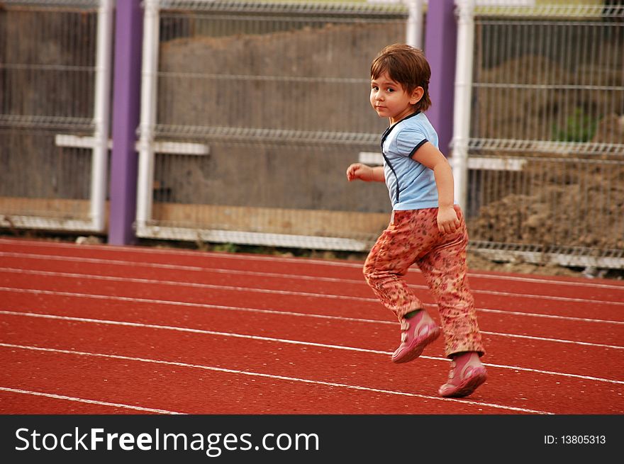 A little girl running on the runway. A little girl running on the runway