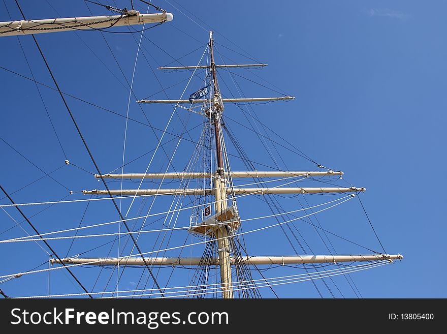 White mast with rigging, ropes and fore top