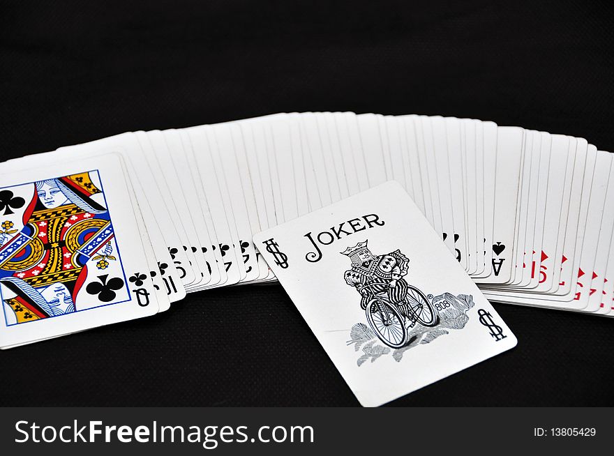 White playing cards and joker