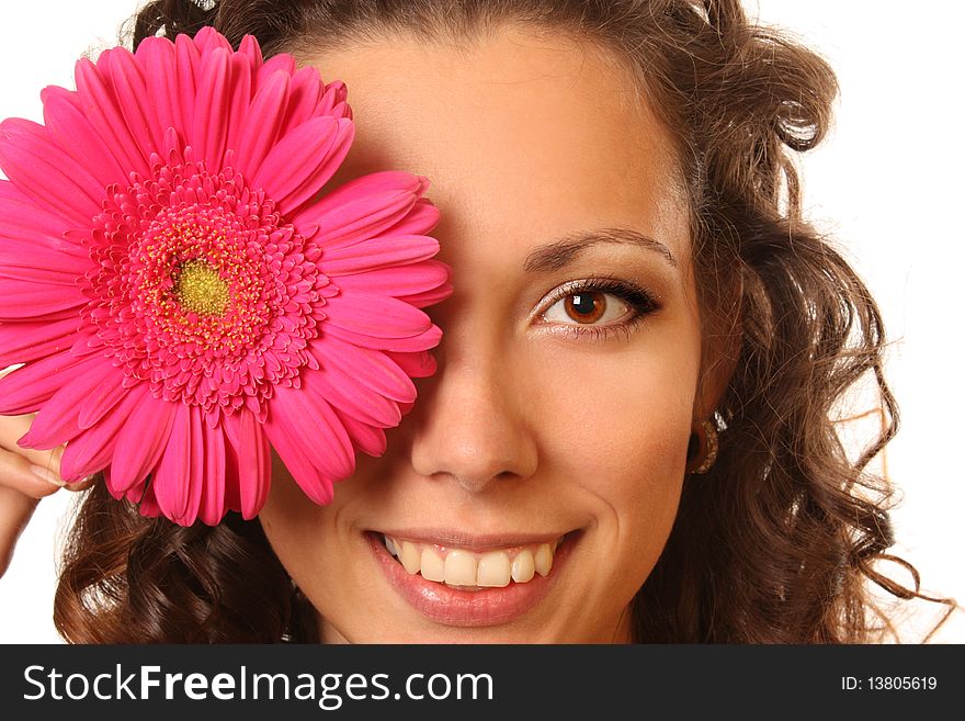 Beautiful young woman with curly long hairs and bright flower. Beautiful young woman with curly long hairs and bright flower