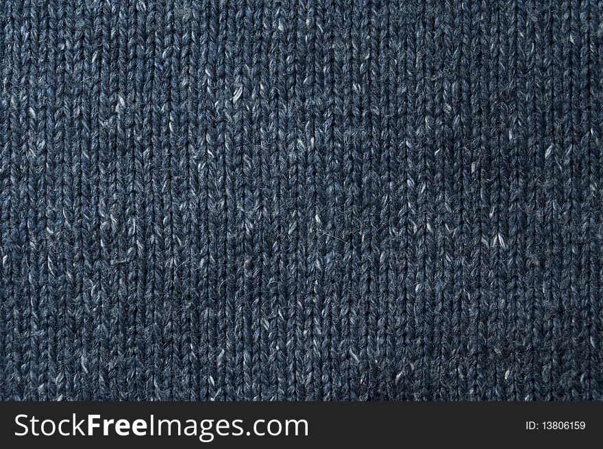 Woolen knitted sweater of dark blue color. Woolen knitted sweater of dark blue color