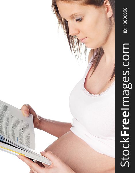 Pregnant girl reading a book isolated on white background. Pregnant girl reading a book isolated on white background