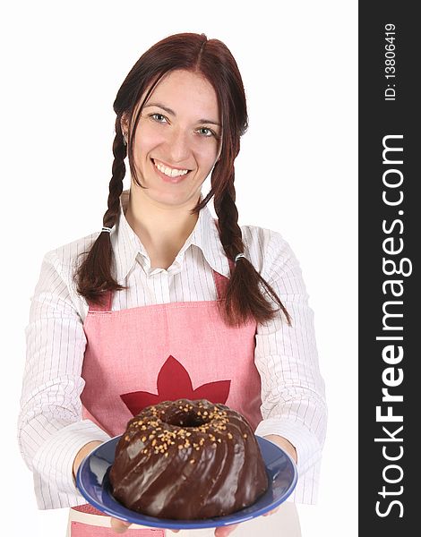Beautiful housewife showing off bundt cake on white background