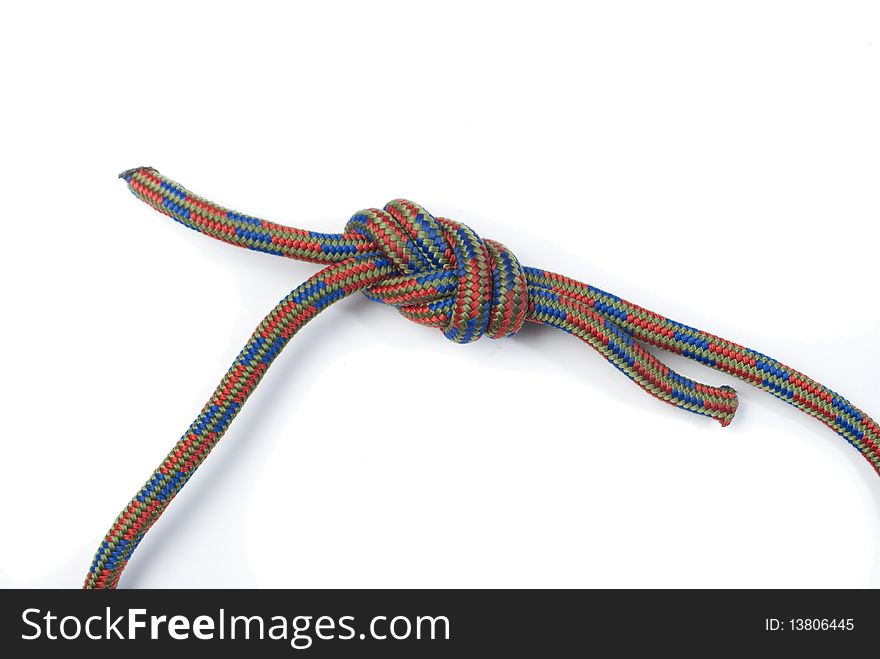 Coloured rope bundled up on white background