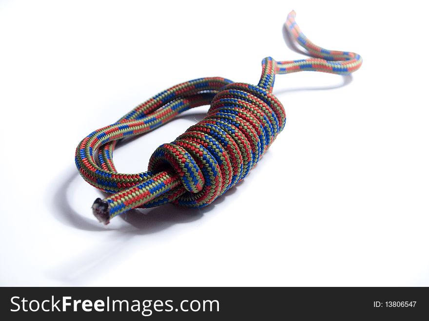 Coloured rope bundled up on white background