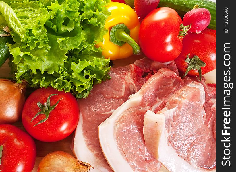 Raw pork and spring fresh and ripe vegetables. Raw pork and spring fresh and ripe vegetables