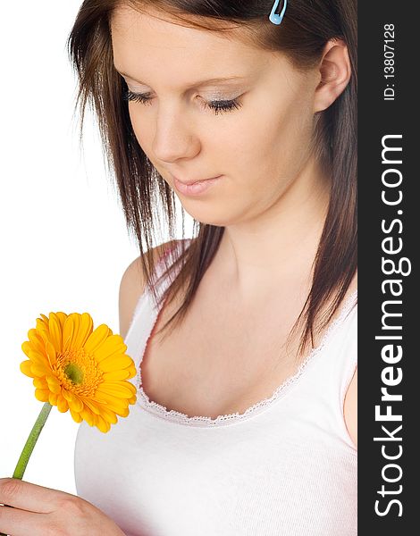 Girl with a orange gerbera flower in the hand isolated on white background. Girl with a orange gerbera flower in the hand isolated on white background