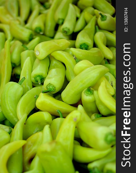 Bunch of organic green peppers on the market for sale
