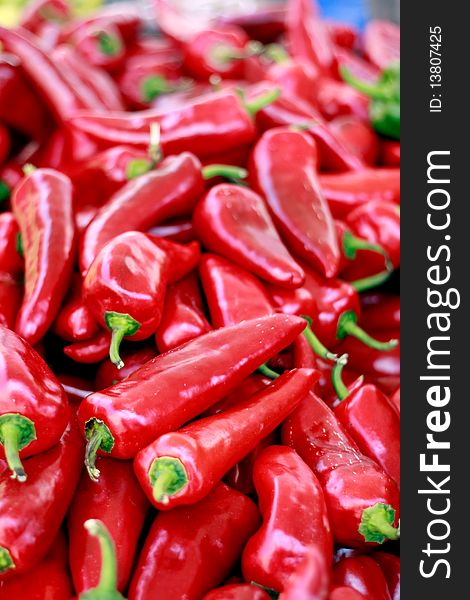 Bunch of organic red peppers on the market