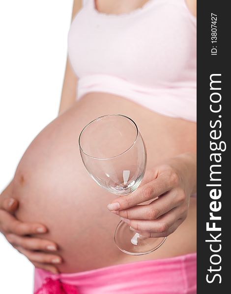 Pregnant girl with a wine glass in the hand. Pregnant girl with a wine glass in the hand