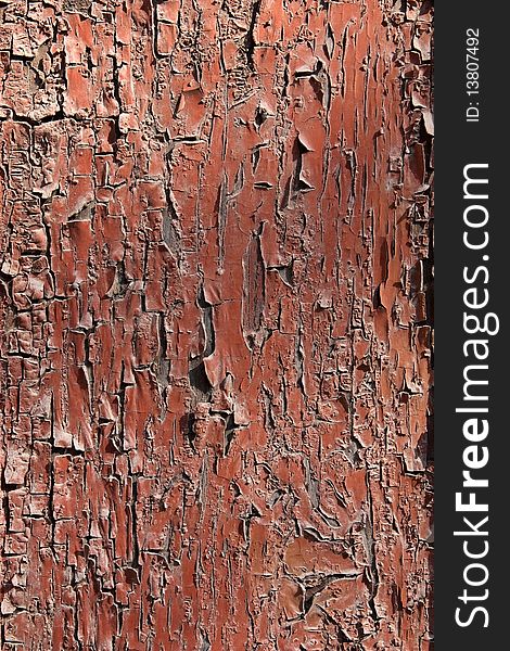 Abstraction, an old wooden surface red, peeling paint