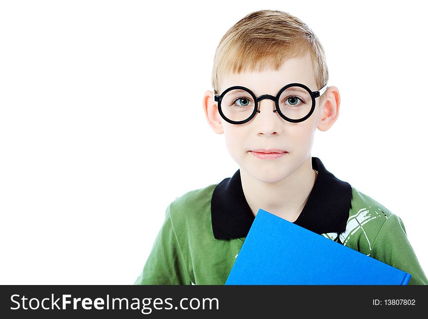 Portrait of a boy in a funny glasses holding a book. Isolated over white background. Portrait of a boy in a funny glasses holding a book. Isolated over white background.
